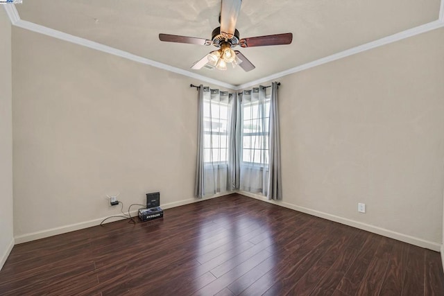 empty room featuring dark wood-type flooring, ornamental molding, and ceiling fan