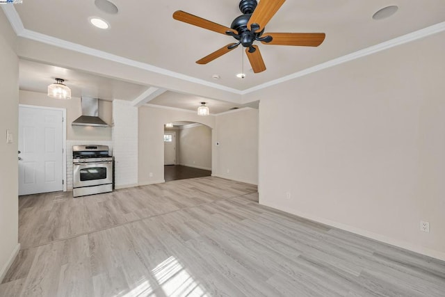 unfurnished living room featuring crown molding, ceiling fan, and light hardwood / wood-style flooring