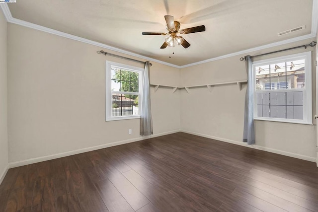 unfurnished room featuring crown molding, dark wood-type flooring, and ceiling fan