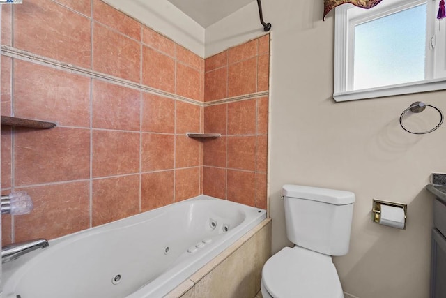 bathroom with tiled shower / bath and toilet