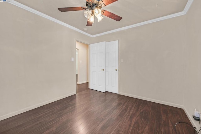 spare room featuring ornamental molding, dark hardwood / wood-style floors, and ceiling fan