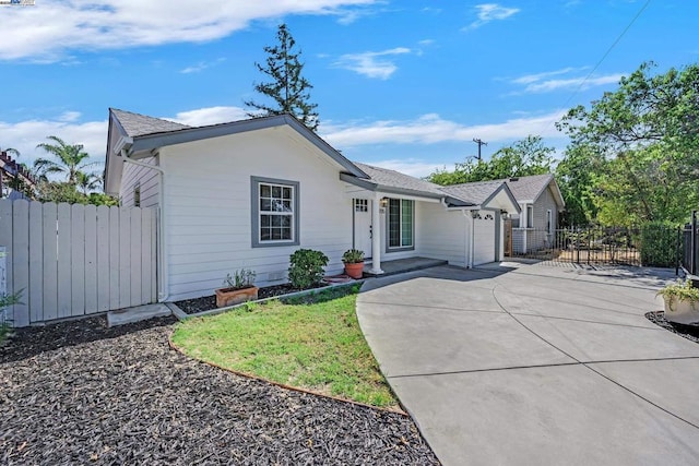 ranch-style home featuring a garage