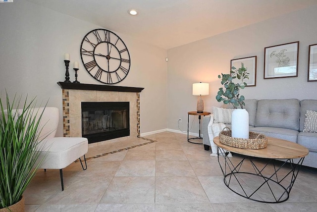 tiled living room featuring a tile fireplace