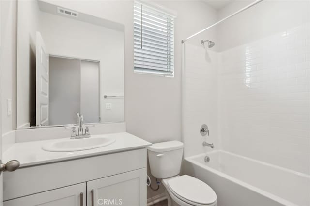 full bathroom with washtub / shower combination, vanity, and toilet