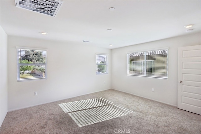 view of carpeted spare room