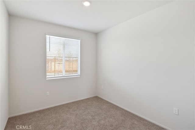 empty room featuring light colored carpet