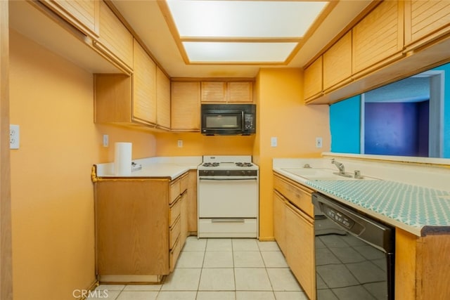 kitchen featuring light tile patterned floors, sink, and black appliances