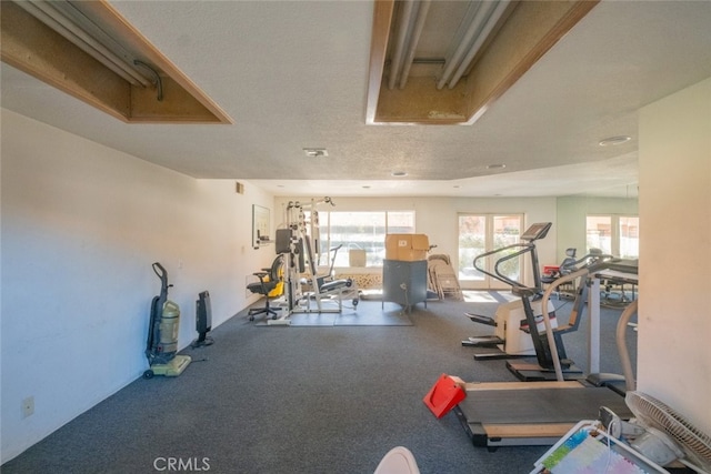 workout area with a textured ceiling