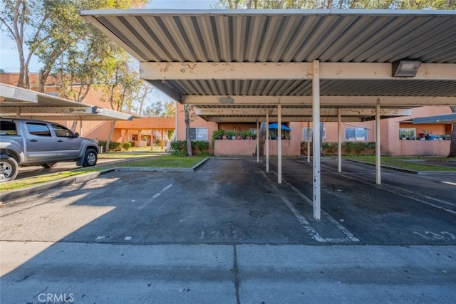 view of parking featuring a carport