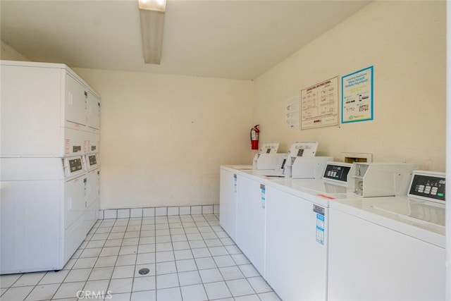 washroom featuring stacked washing maching and dryer and washer and clothes dryer