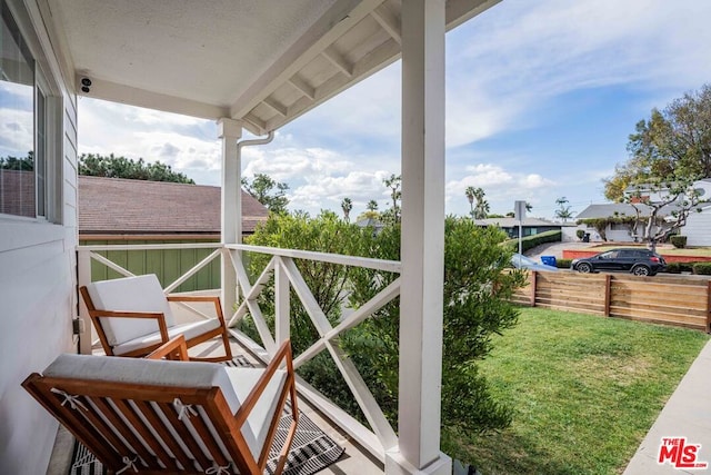 balcony featuring a porch