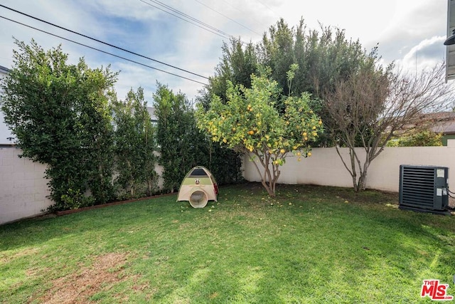 view of yard featuring central AC