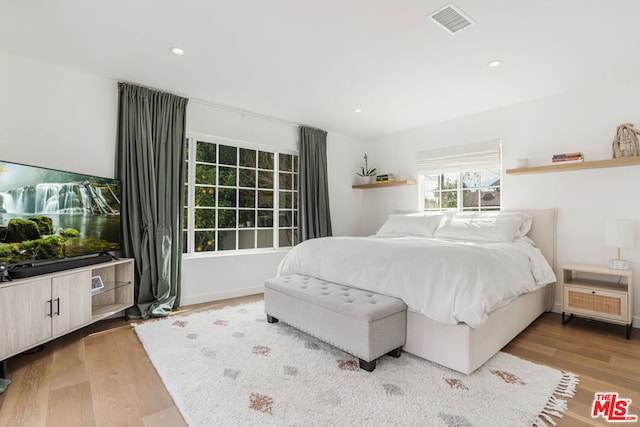 bedroom featuring light wood-type flooring