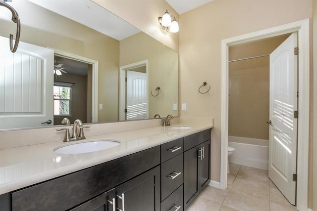 full bathroom featuring tile patterned flooring, vanity, shower / bath combination, and toilet