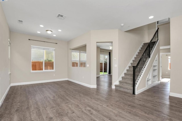 interior space featuring dark hardwood / wood-style floors and built in features