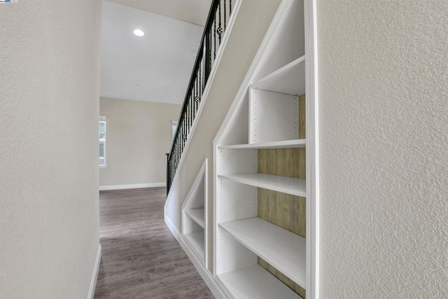 stairway featuring hardwood / wood-style floors