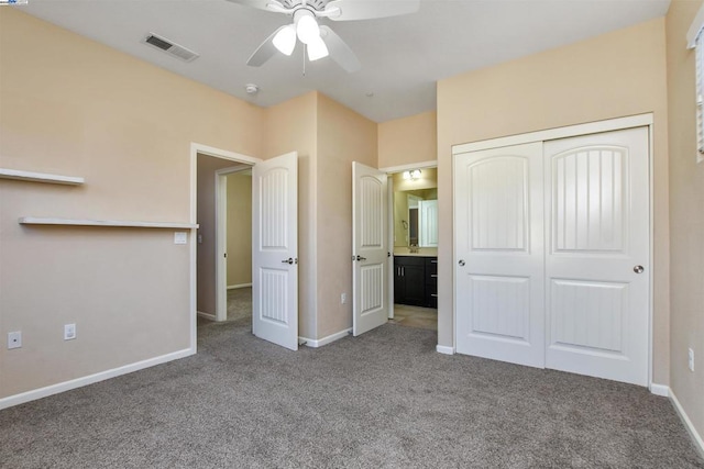 unfurnished bedroom with a closet, ceiling fan, and carpet flooring