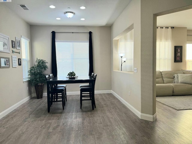 dining room with hardwood / wood-style flooring