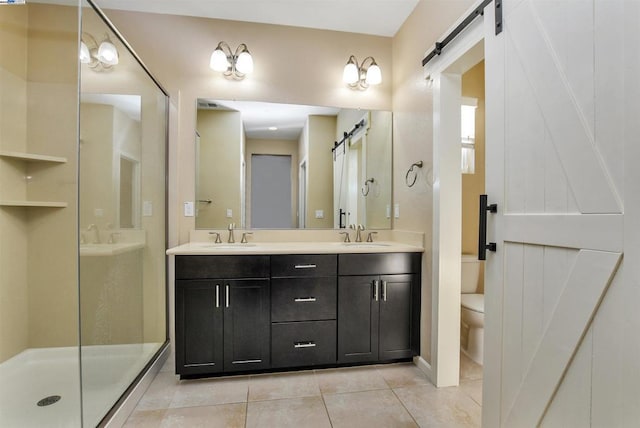 bathroom with tile patterned flooring, vanity, toilet, and an enclosed shower