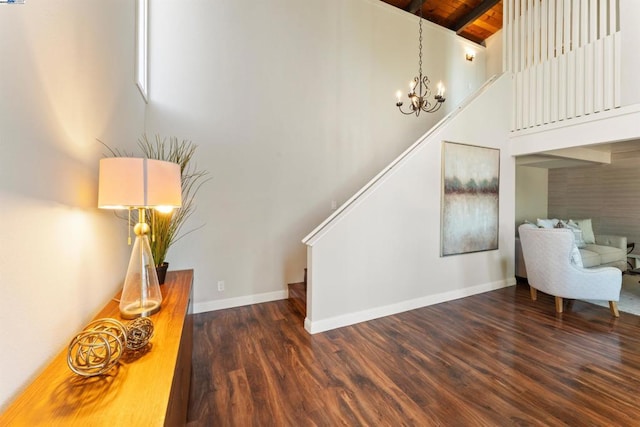 stairs with high vaulted ceiling, wood-type flooring, a chandelier, wooden ceiling, and beam ceiling