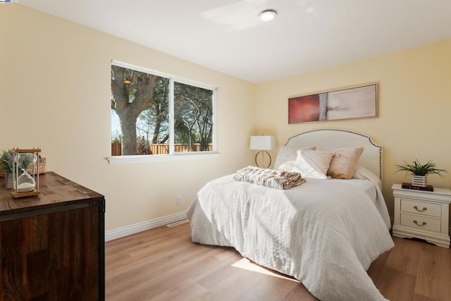 bedroom with light wood-type flooring