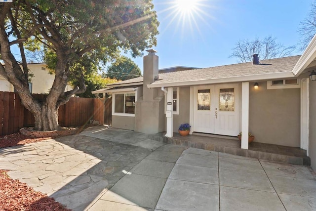 entrance to property featuring a patio area