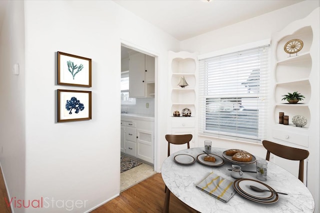 dining area featuring hardwood / wood-style floors