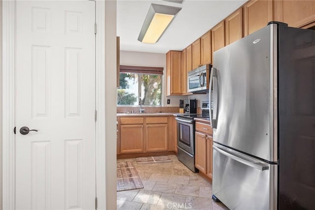 kitchen featuring appliances with stainless steel finishes and sink