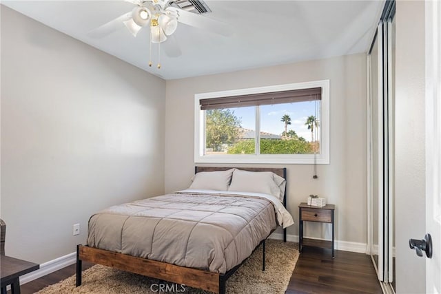 bedroom featuring ceiling fan and dark hardwood / wood-style flooring