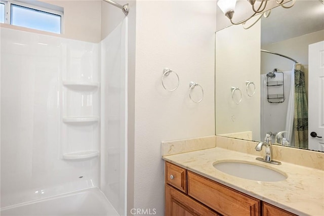 bathroom with vanity and shower / bathing tub combination