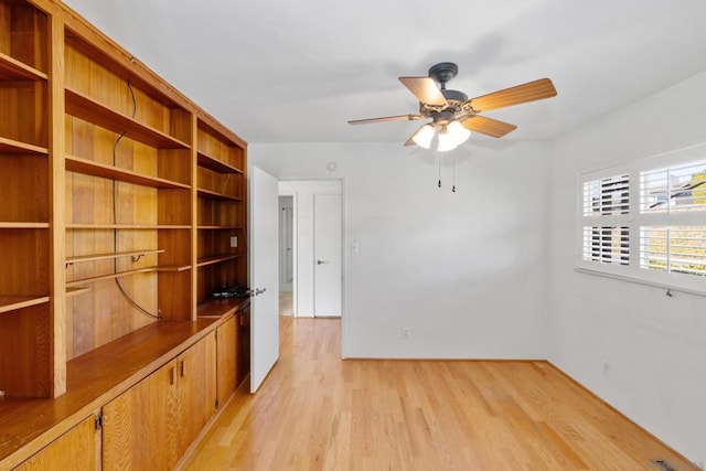 unfurnished room with ceiling fan and light hardwood / wood-style floors