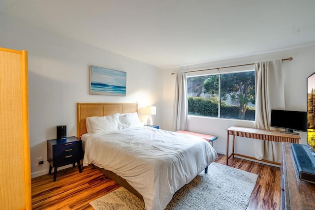 bedroom featuring dark hardwood / wood-style floors