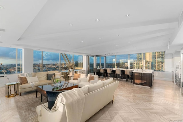 living room featuring sink and light parquet flooring