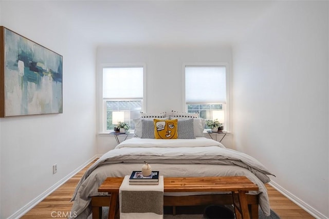 bedroom with hardwood / wood-style floors