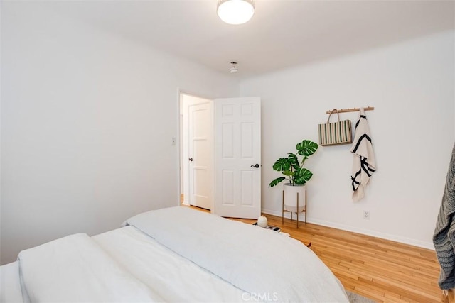 bedroom featuring hardwood / wood-style floors