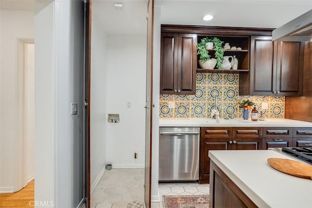 kitchen featuring dark brown cabinetry, custom exhaust hood, light tile patterned floors, dishwasher, and decorative backsplash