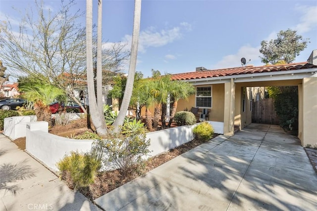 view of front of home with a carport