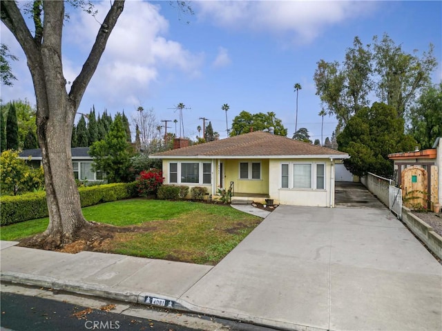 ranch-style house with a front lawn