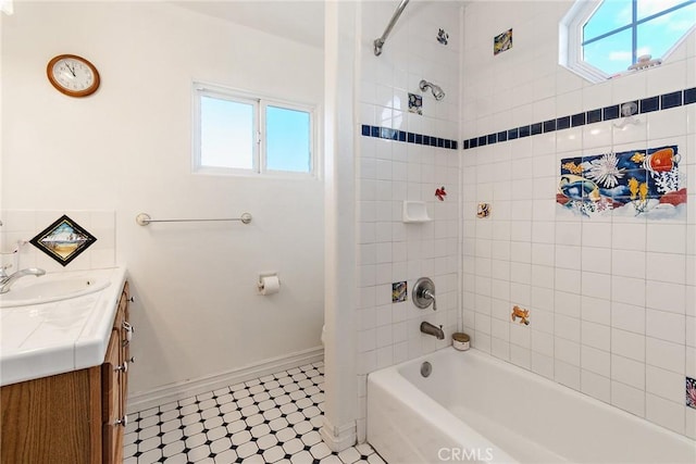 full bathroom with tiled shower / bath combo, vanity, and toilet