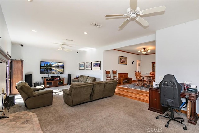 living room featuring crown molding, carpet floors, and ceiling fan