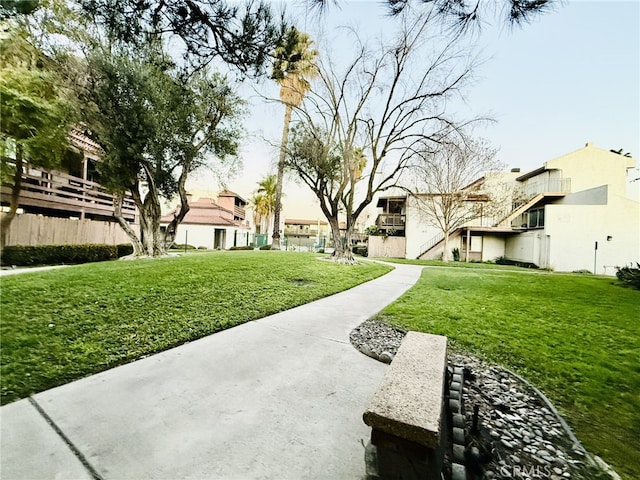 surrounding community featuring a lawn