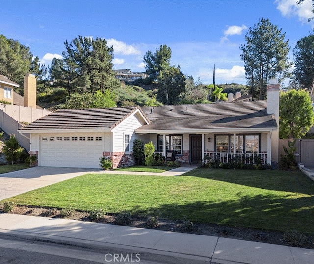 ranch-style house with a garage and a front lawn