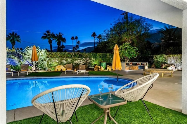 view of swimming pool featuring a patio area