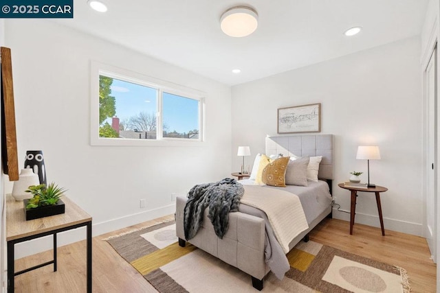 bedroom featuring light hardwood / wood-style floors