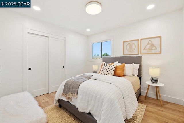 bedroom with light hardwood / wood-style floors