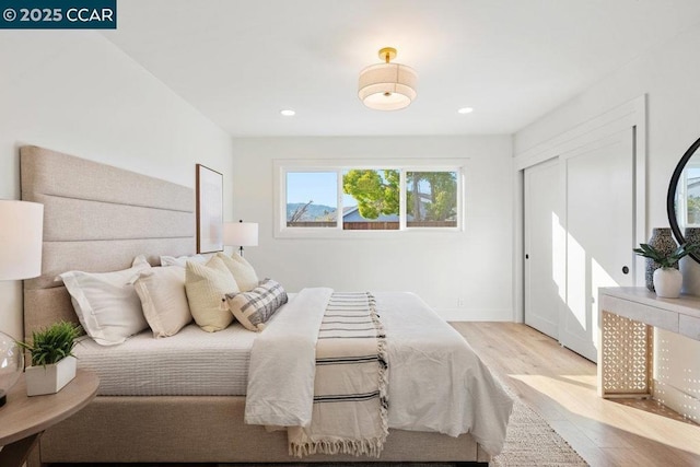 bedroom with light wood-type flooring