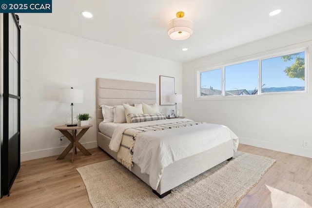 bedroom with light wood-type flooring