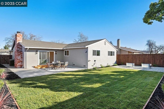 back of property featuring central AC unit, a patio, and a lawn