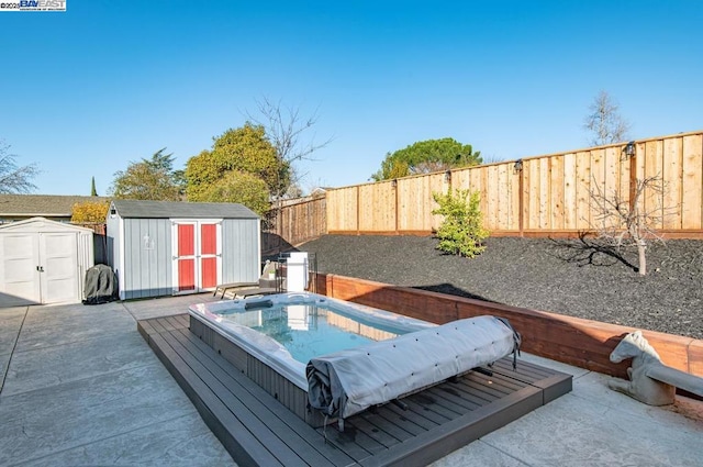 wooden deck featuring a shed