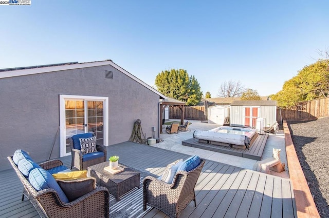 deck featuring a gazebo and a storage unit